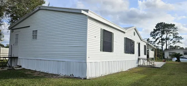a view of backyard with a garden and slide