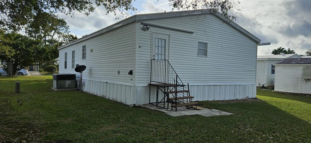 3636 South Lazy Lake Drive Lakeland, FL 33801 - Photo 28 of 28 a view of backyard with a garden and slide