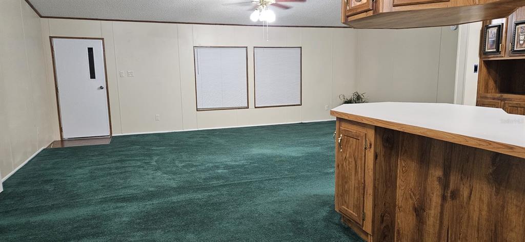 3636 South Lazy Lake Drive Lakeland, FL 33801 - Photo 7 of 28 a kitchen with kitchen island a sink and wooden floor