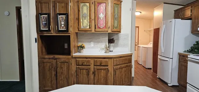 a bathroom with a sink a mirror and a shower