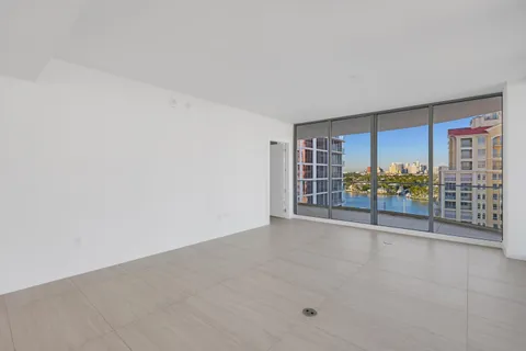 a view of an empty room with a window