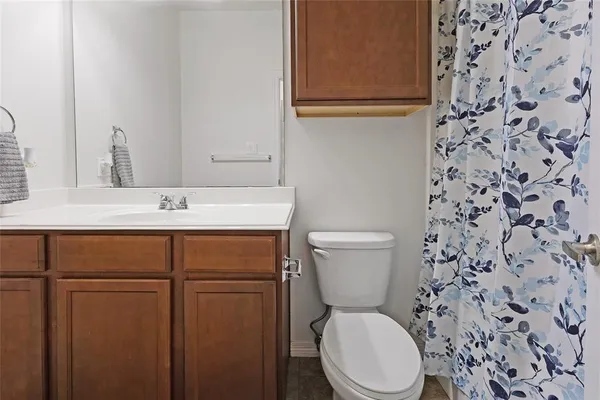 a bathroom with a toilet and a sink