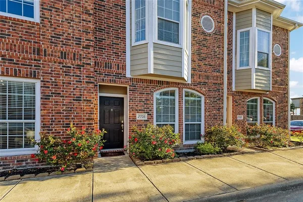 a front view of a house having yard