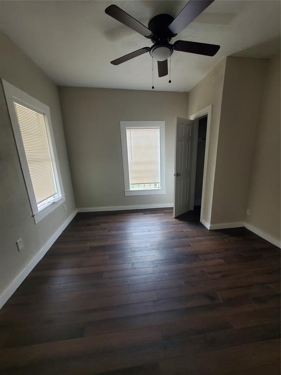 401 North Moore Street Dallas, TX 75203 - Photo 2 of 8 a view of an empty room with wooden floor and a window