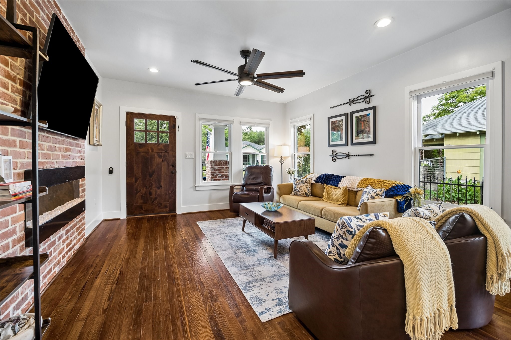 1019 East 14th Street Houston, TX 77009 - Photo 7 of 34 a living room with furniture fireplace and a flat screen tv