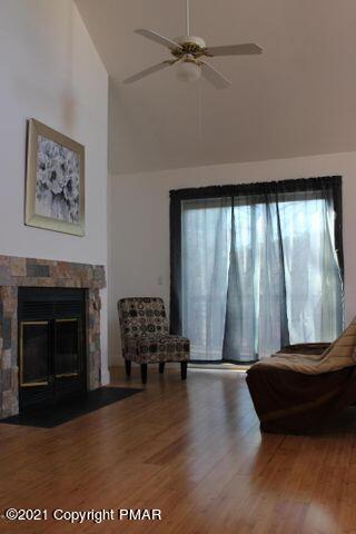 3318 Windermere Drive Bushkill, PA 18324 - Photo 16 of 35 a living room with furniture and a fireplace