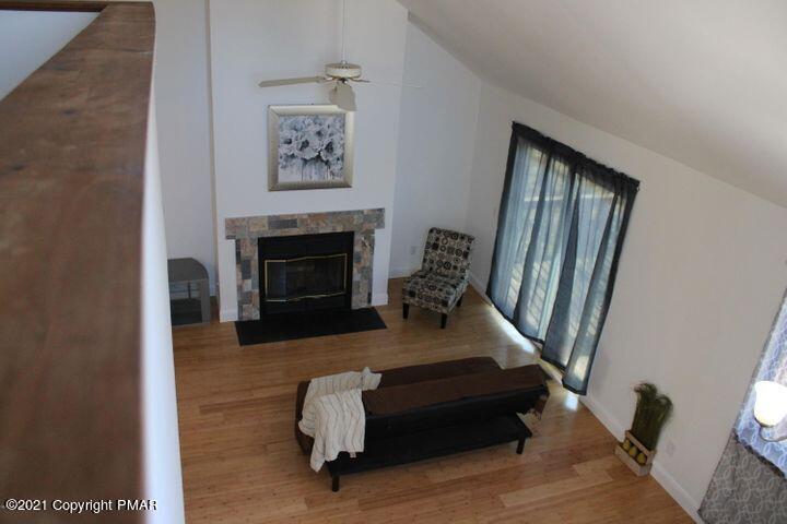 3318 Windermere Drive Bushkill, PA 18324 - Photo 21 of 35 a living room with furniture and a fireplace