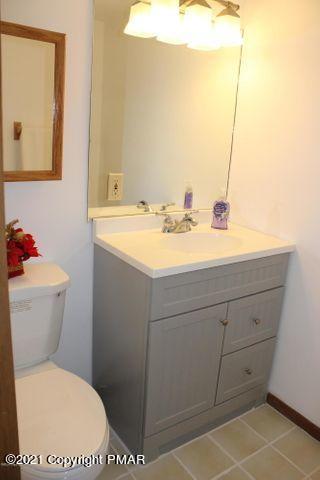 3318 Windermere Drive Bushkill, PA 18324 - Photo 23 of 35 a bathroom with a sink toilet and vanity