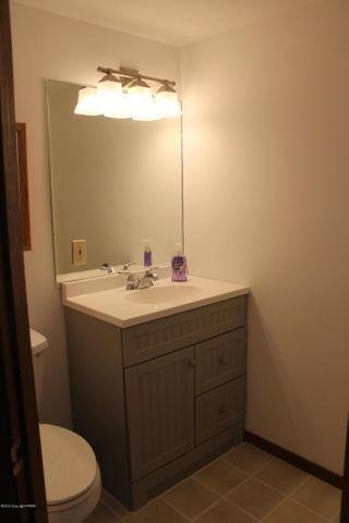 3318 Windermere Drive Bushkill, PA 18324 - Photo 25 of 35 a bathroom with a sink mirror vanity and toilet