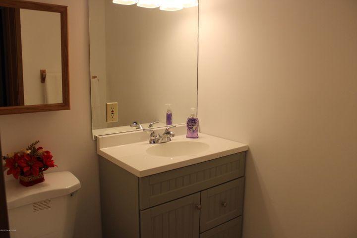 3318 Windermere Drive Bushkill, PA 18324 - Photo 26 of 35 a bathroom with a sink toilet and a mirror
