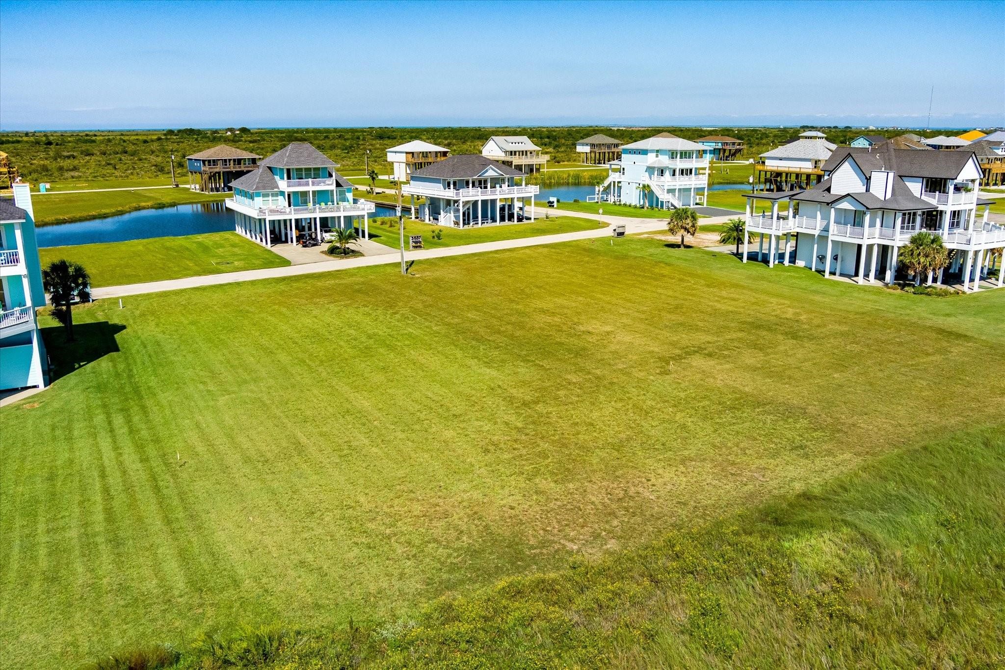 3642 Biscayne Beach Road Port Bolivar, TX 77650 - Photo 2 of 7 a view of a swimming pool with an ocean view