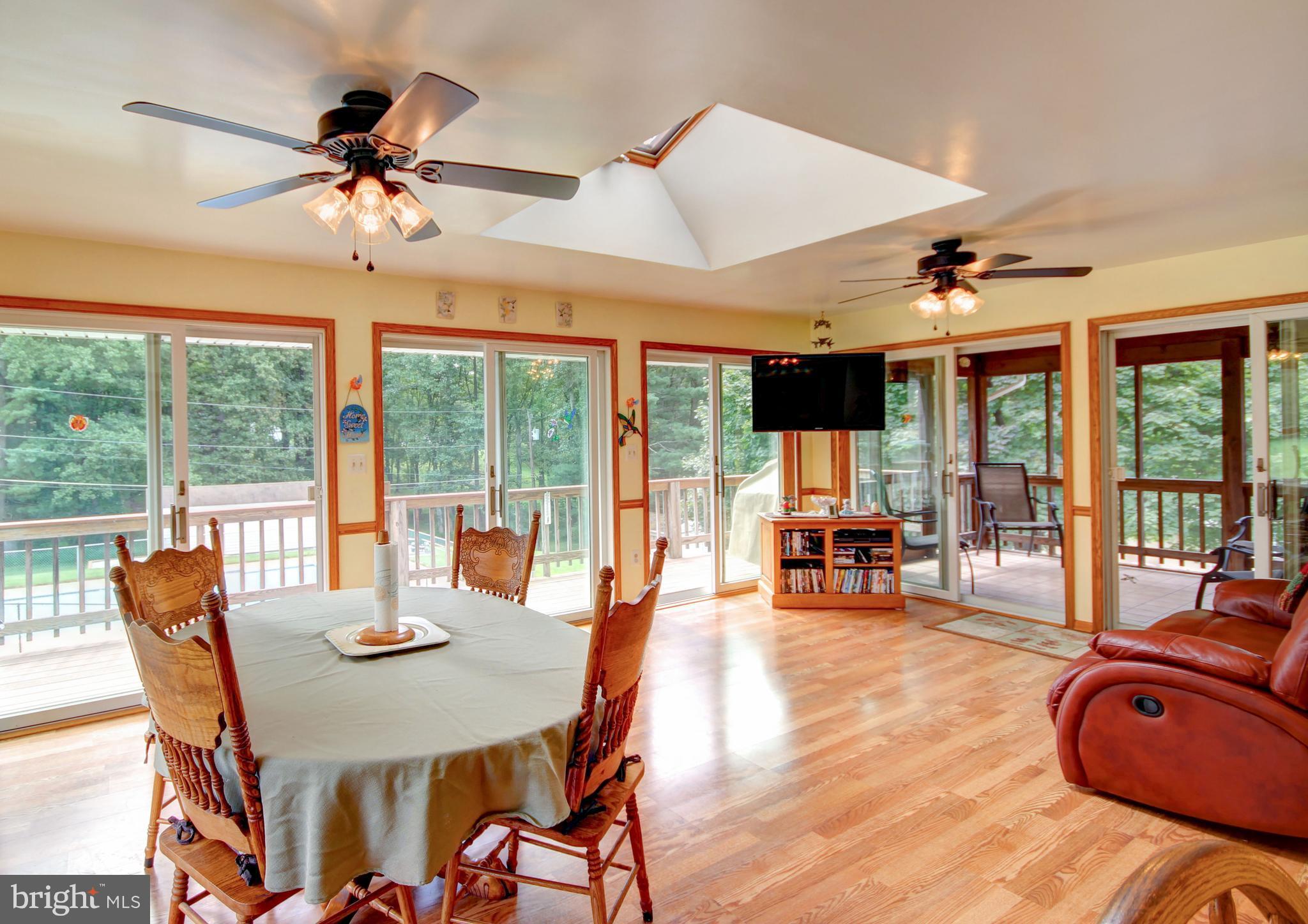 5302 Wendy Road Sykesville, MD 21784 - Photo 3 of 30 Kitchen sunroom, 3 sliders to deck, screened porch