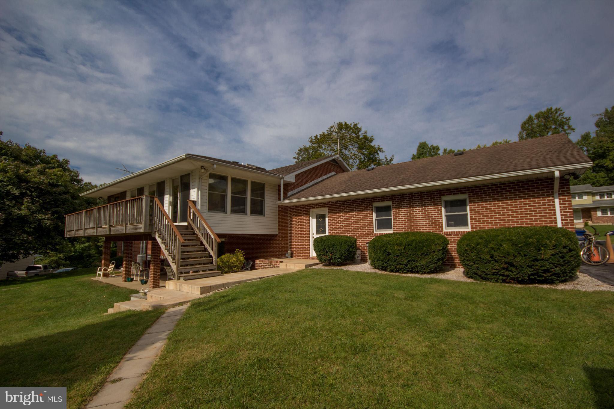 5302 Wendy Road Sykesville, MD 21784 - Photo 26 of 30 rear of house, sunroom, patio)