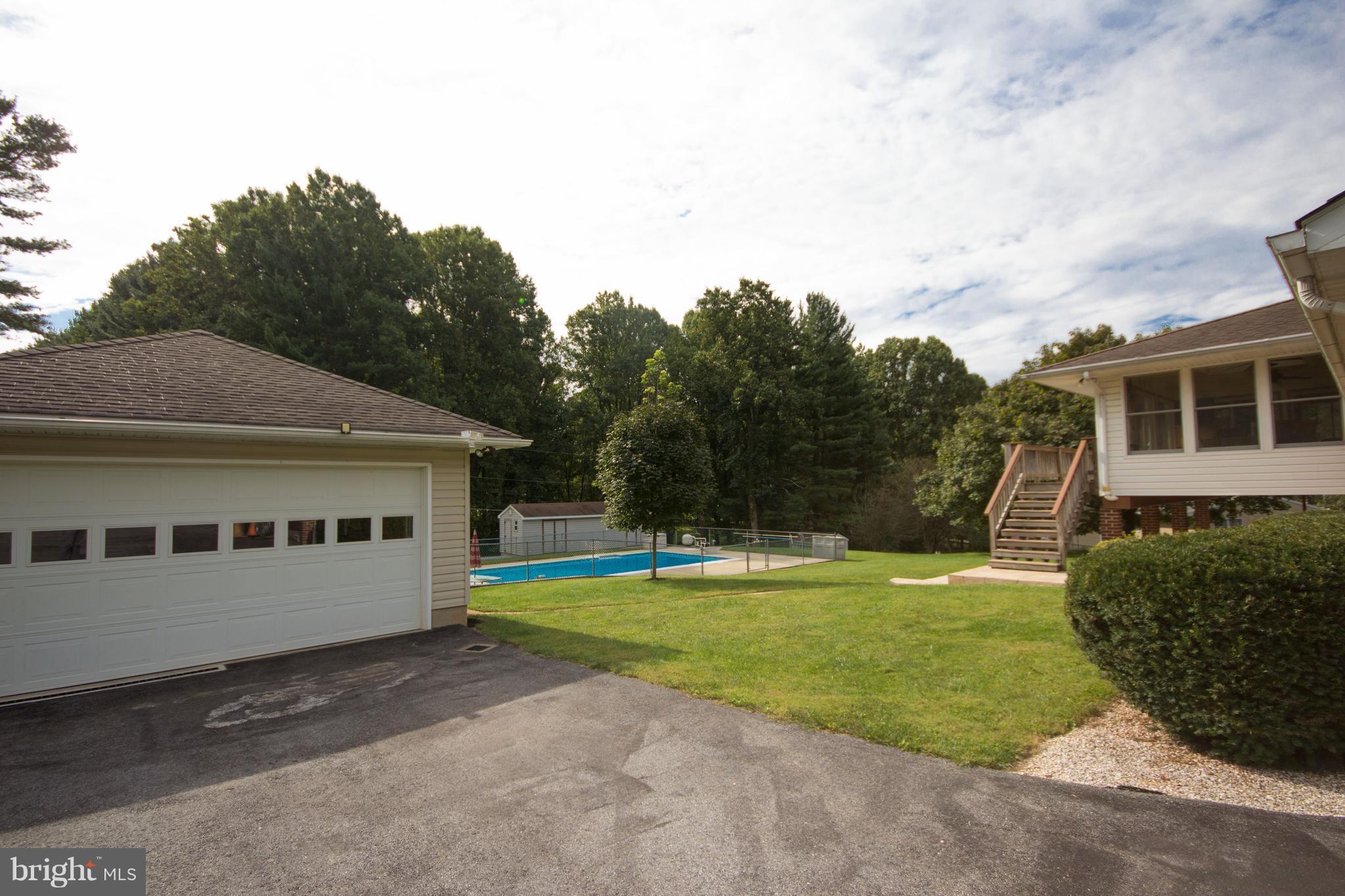 5302 Wendy Road Sykesville, MD 21784 - Photo 5 of 30 2 car detached garage, workshop looking over pool