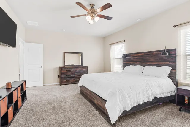a bathroom with a tub and shower