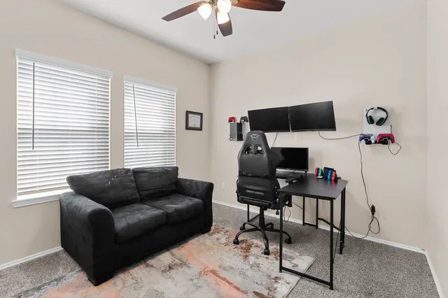 a bathroom with a sink mirror vanity and toilet