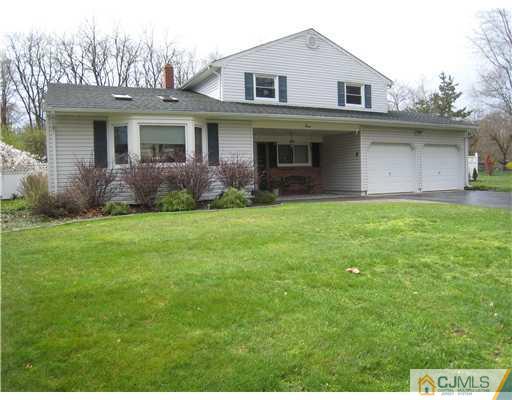 7 Butler Road Edison, NJ 08820 - Photo 2 of 18 a front view of a house with a yard