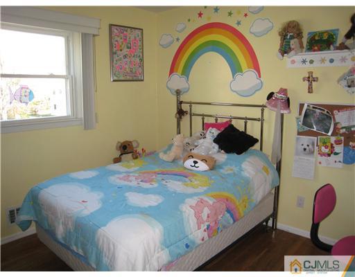 7 Butler Road Edison, NJ 08820 - Photo 11 of 18 a bedroom with a bed and dresser