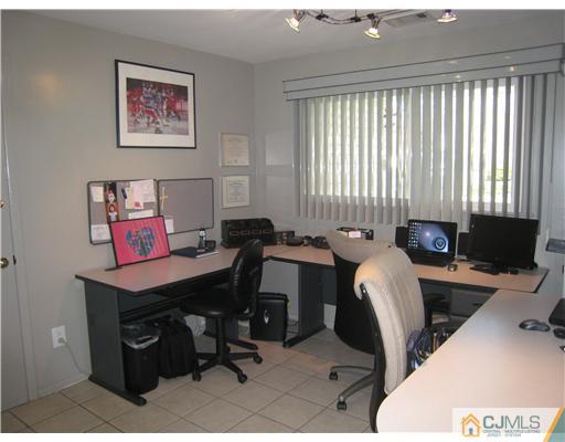 7 Butler Road Edison, NJ 08820 - Photo 12 of 18 a view of a workspace with furniture and a window