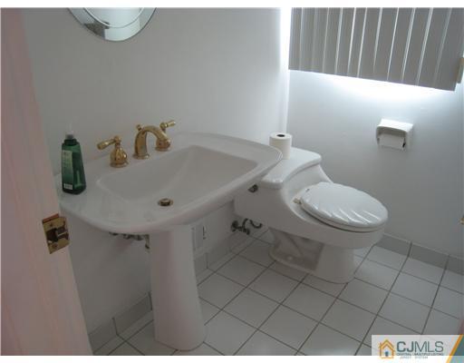 7 Butler Road Edison, NJ 08820 - Photo 13 of 18 a bathroom with a sink and toilet