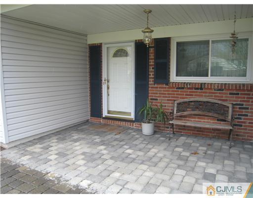 7 Butler Road Edison, NJ 08820 - Photo 3 of 18 a view of house with backyard and glass windows