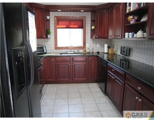 7 Butler Road Edison, NJ 08820 - Photo 4 of 18 a kitchen with stainless steel appliances granite countertop a refrigerator and a sink