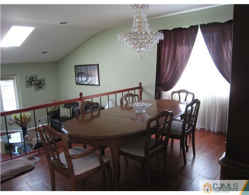 7 Butler Road Edison, NJ 08820 - Photo 6 of 18 a view of a dining room with furniture window and wooden floor