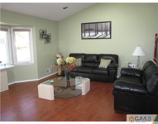 7 Butler Road Edison, NJ 08820 - Photo 7 of 18 a living room with furniture flowerpot and window