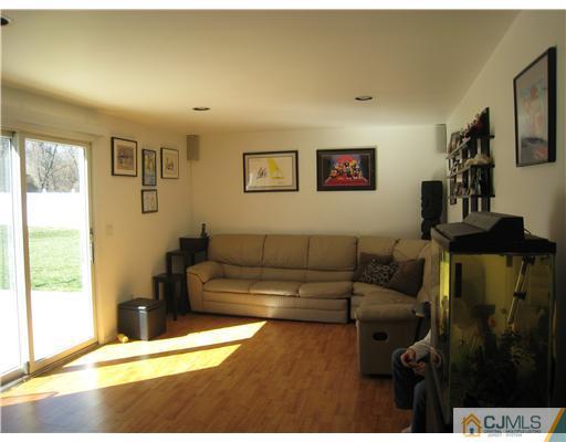 7 Butler Road Edison, NJ 08820 - Photo 8 of 18 a living room with furniture and a floor to ceiling window
