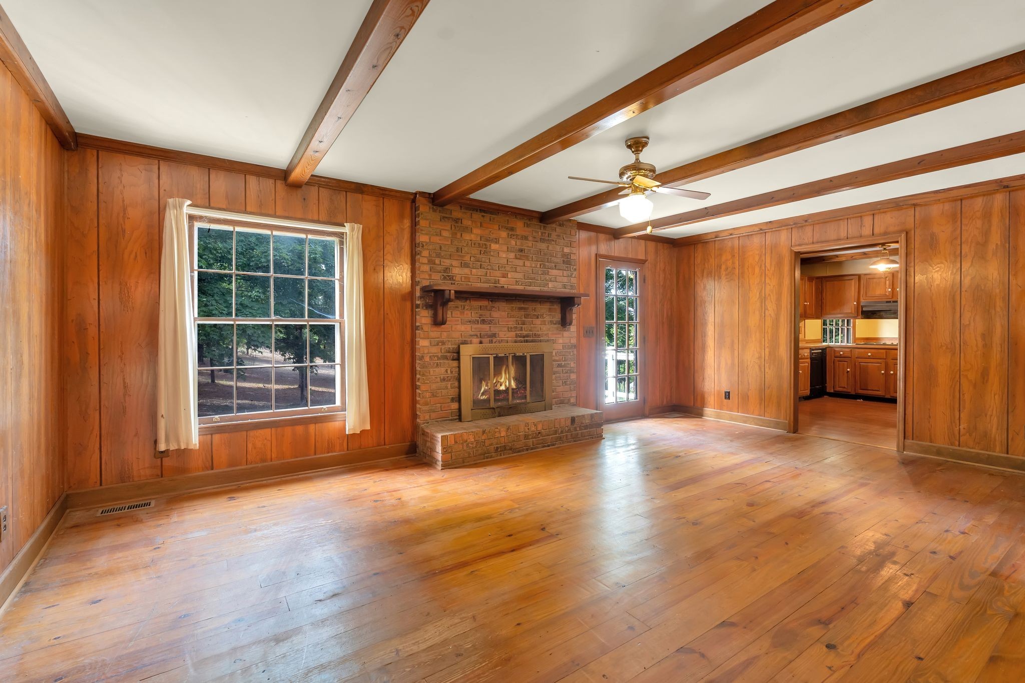 3406 Old Franklin Road Antioch, TN 37013 - Photo 17 of 50 a view of an empty room with a fireplace and a window