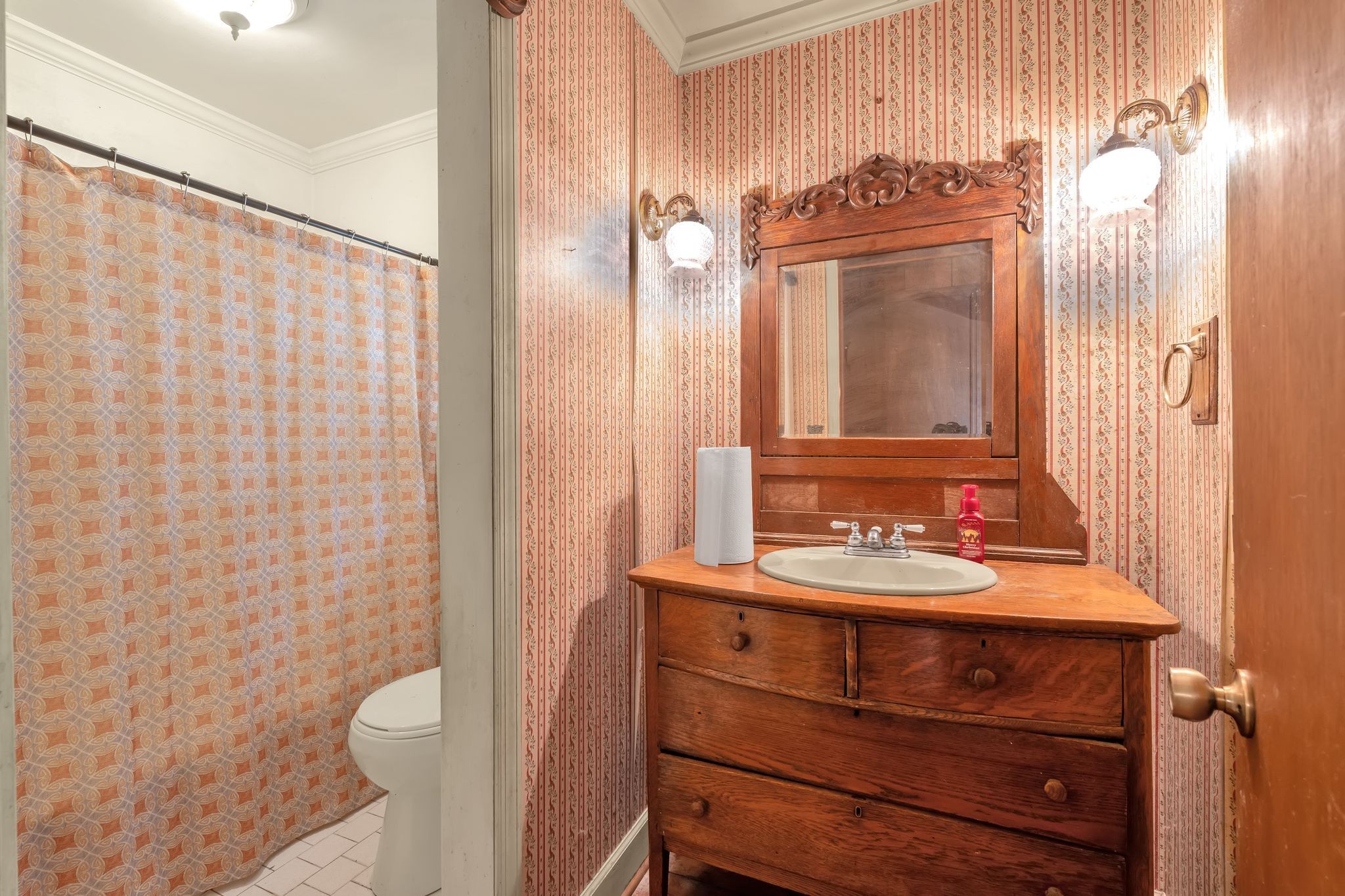 3406 Old Franklin Road Antioch, TN 37013 - Photo 18 of 50 a bathroom with a sink a toilet and shower curtain