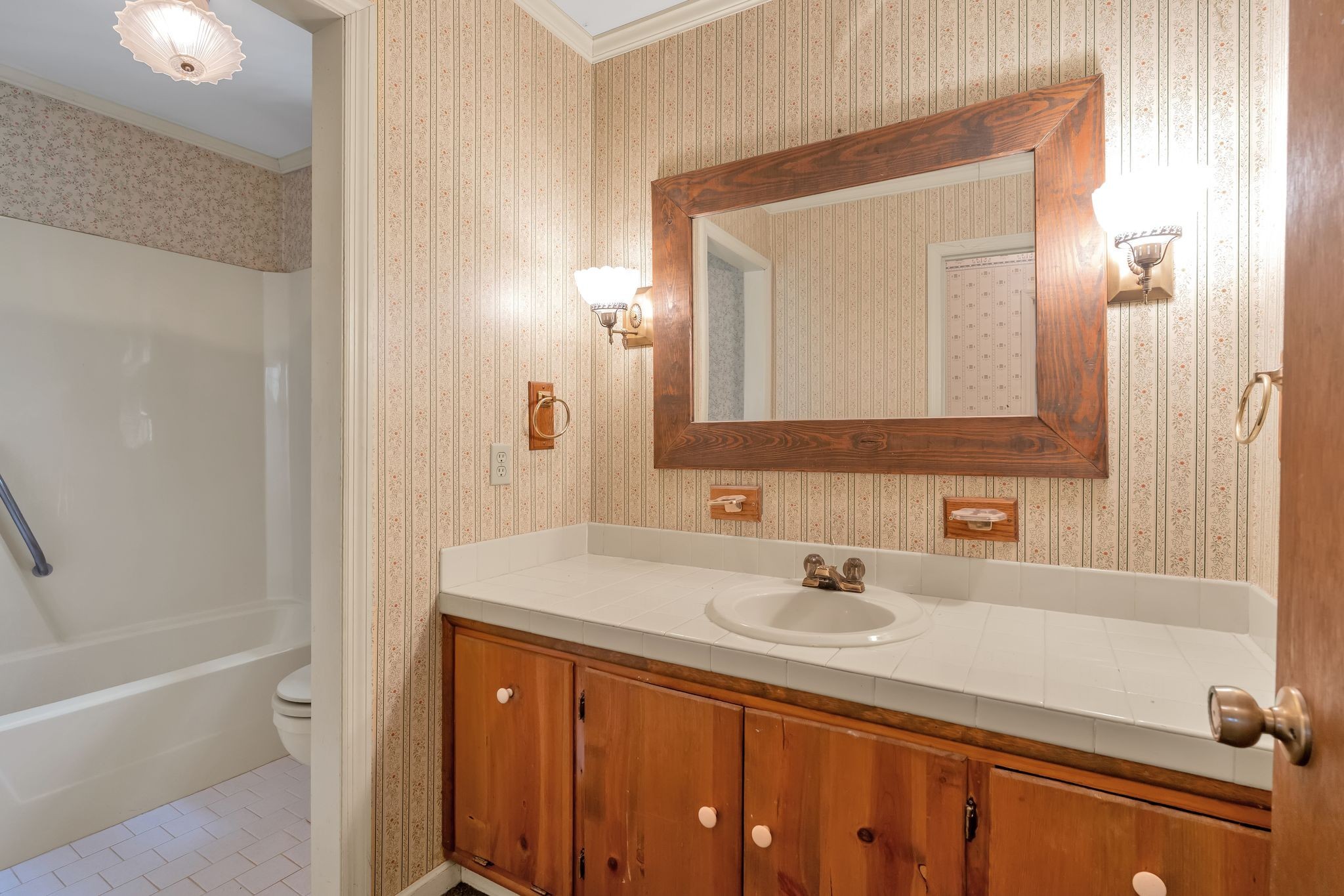 3406 Old Franklin Road Antioch, TN 37013 - Photo 22 of 50 a bathroom with a sink vanity tub and a mirror