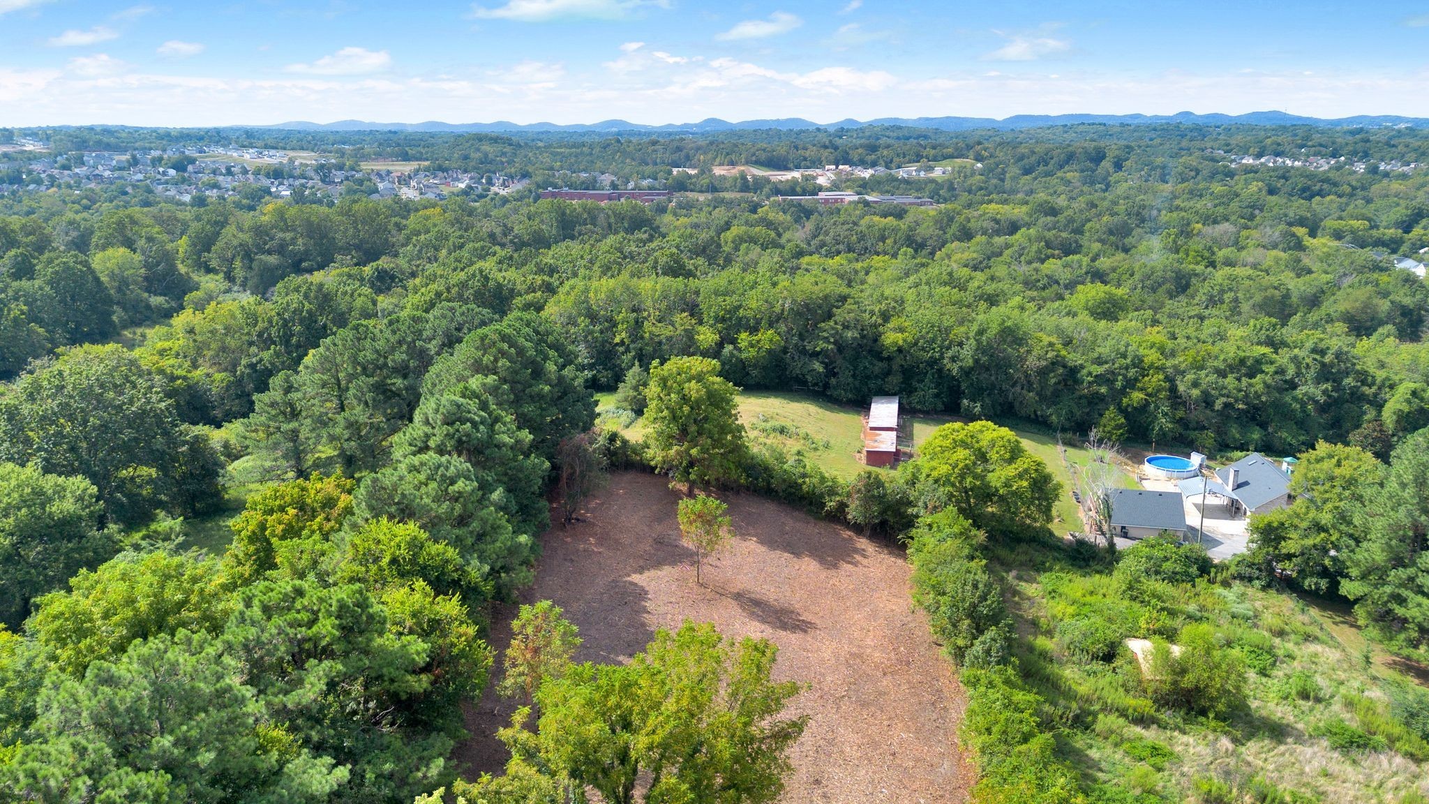 3406 Old Franklin Road Antioch, TN 37013 - Photo 36 of 50 a view of a lush green forest with mountains in the background