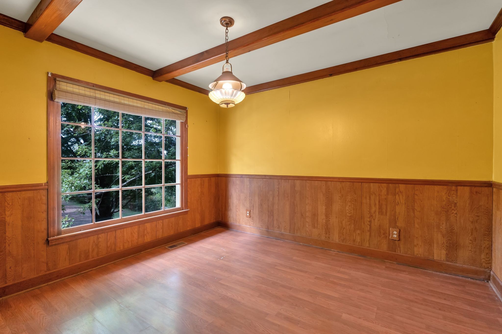 3406 Old Franklin Road Antioch, TN 37013 - Photo 10 of 50 a view of an empty room with a window and wooden floor