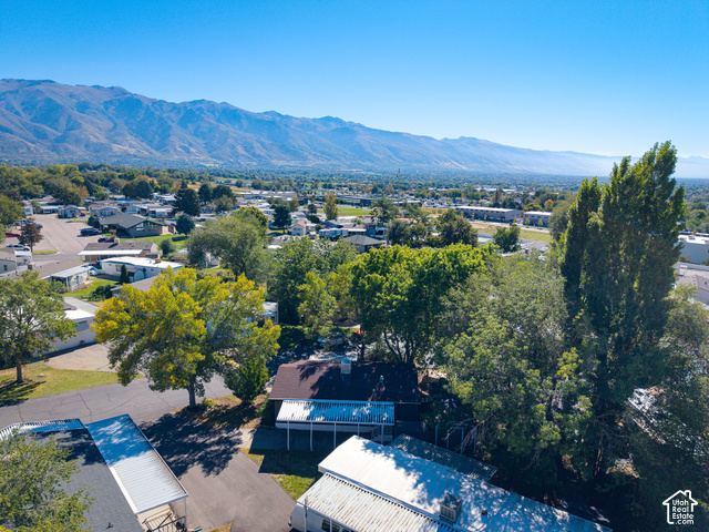 96 Barrington Way Layton, UT 84041 - Photo 18 of 18 Mountain backdrop, residential area, mature trees, paved surfaces, clear skies