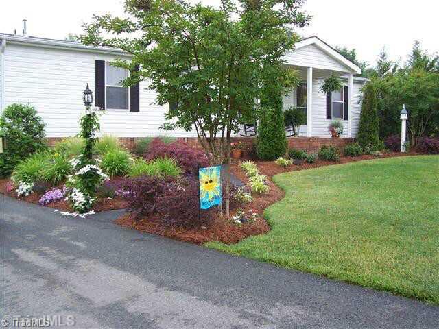 Exterior Front. Wow wonderfully landscaped
