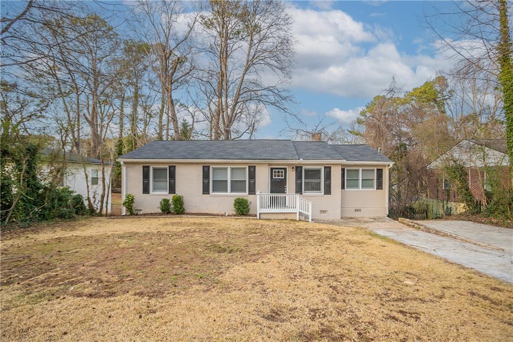 3234 Bluebird Lane Decatur, GA 30032 - Photo 1 of 1 a front view of a house with a garden