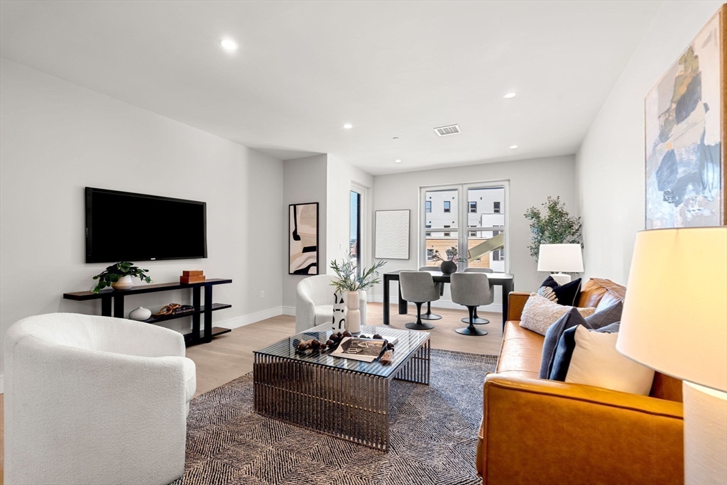 27 Guild Street, Unit 102 Boston, MA 02119 - Photo 4 of 29