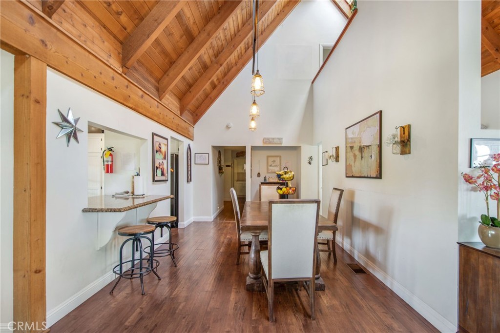 7241 Old Temescal Road Corona, CA 92881 - Photo 31 of 47 a view of a dining room with furniture and wooden floor