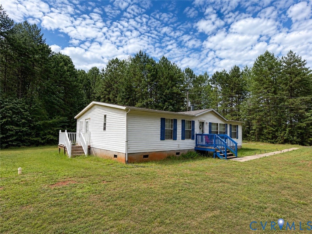 6873 Plank Road Kenbridge, VA 23944 - Photo 2 of 25 White siding exterior with blue shutters and trim