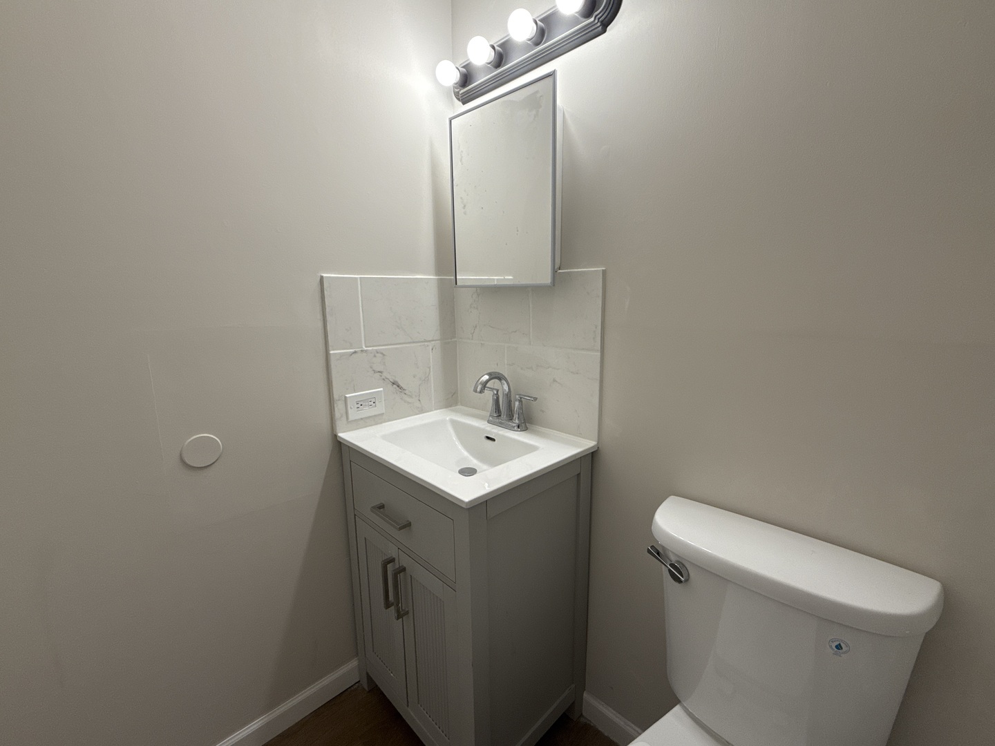 901 Gael Drive, Unit B Joliet, IL 60435 - Photo 14 of 17 a bathroom with a sink toilet and mirror