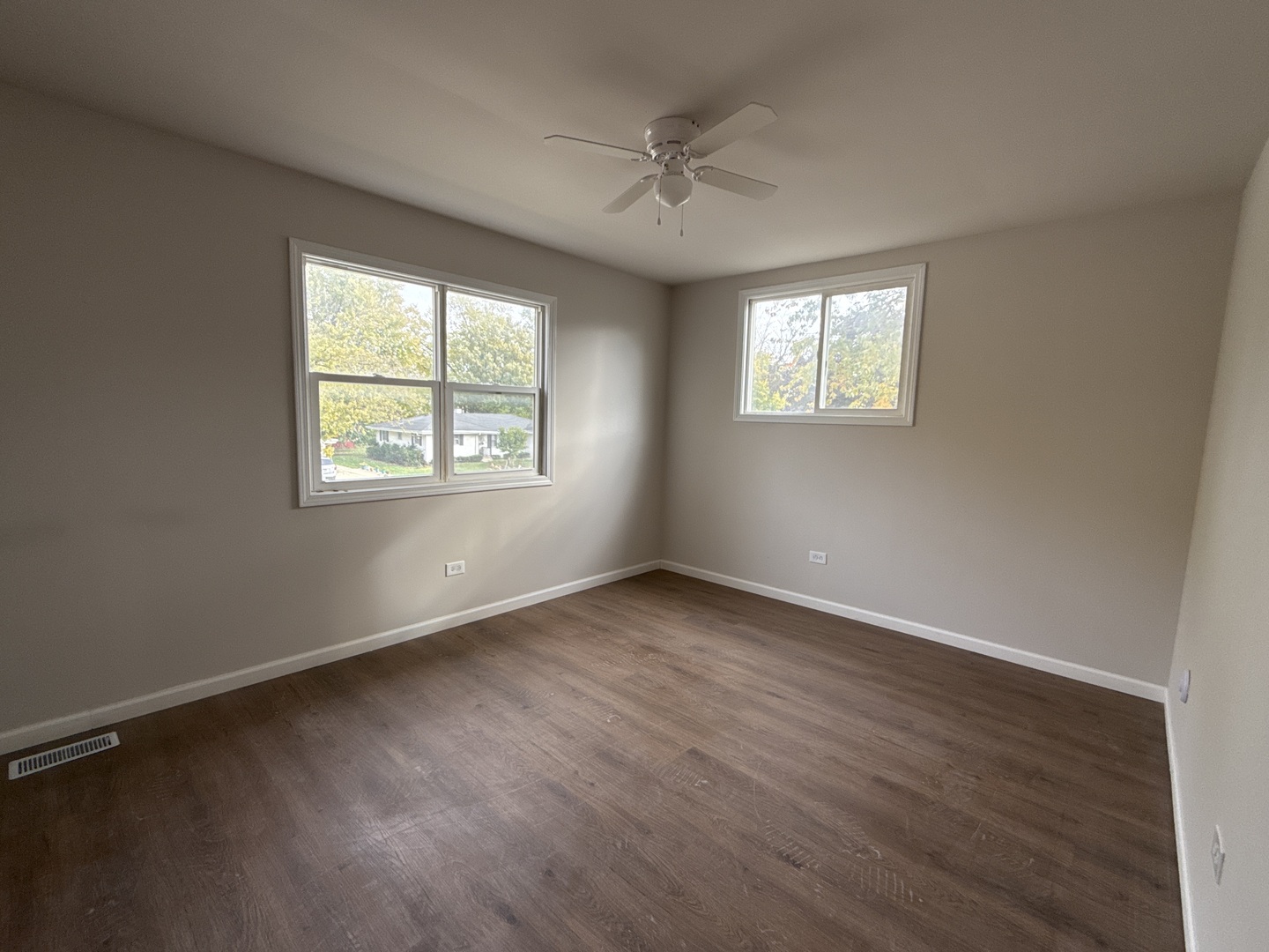 901 Gael Drive, Unit B Joliet, IL 60435 - Photo 15 of 17 an empty room with wooden floor and windows