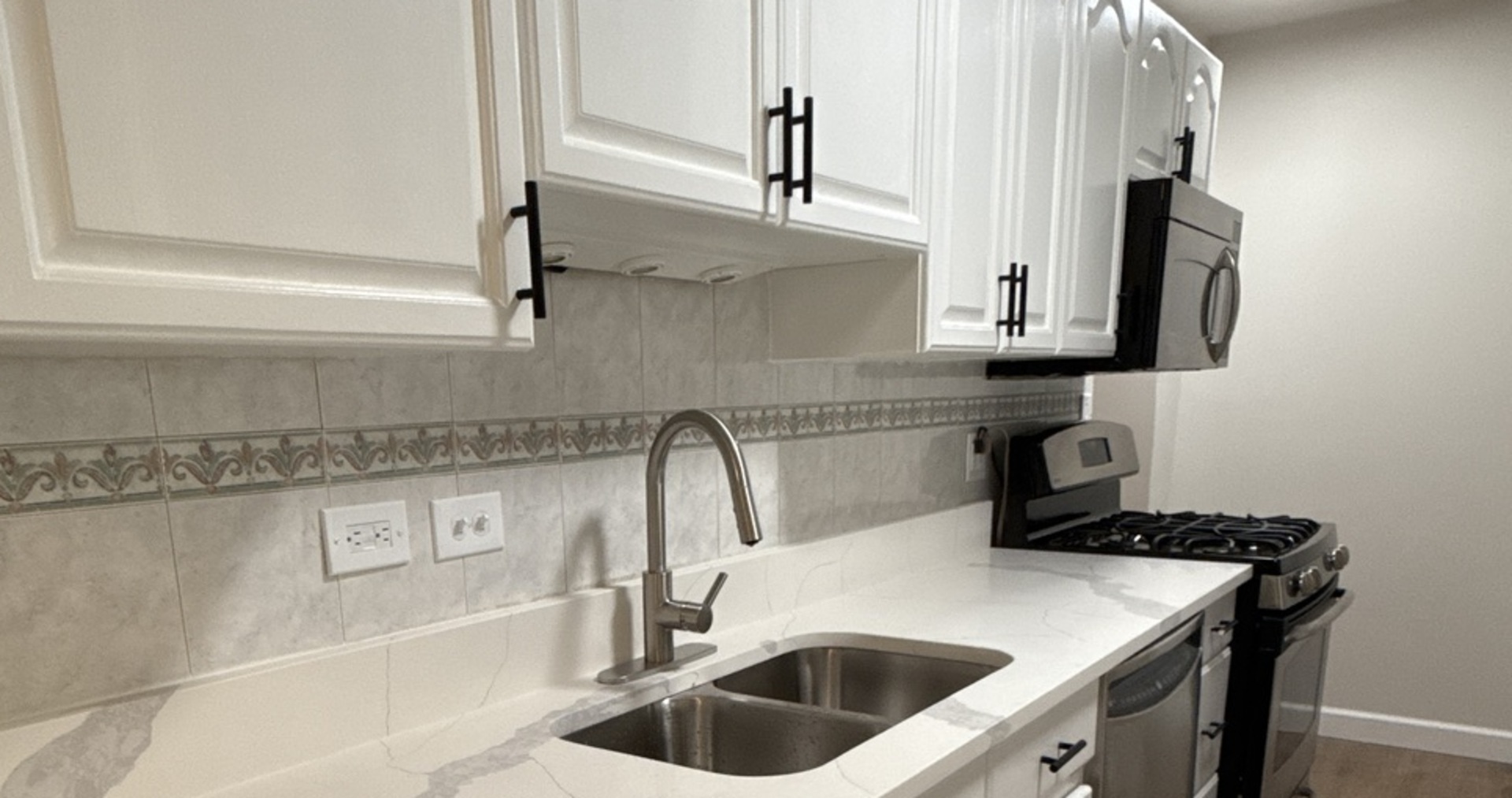 901 Gael Drive, Unit B Joliet, IL 60435 - Photo 17 of 17 a kitchen with stainless steel appliances granite countertop a sink and a refrigerator