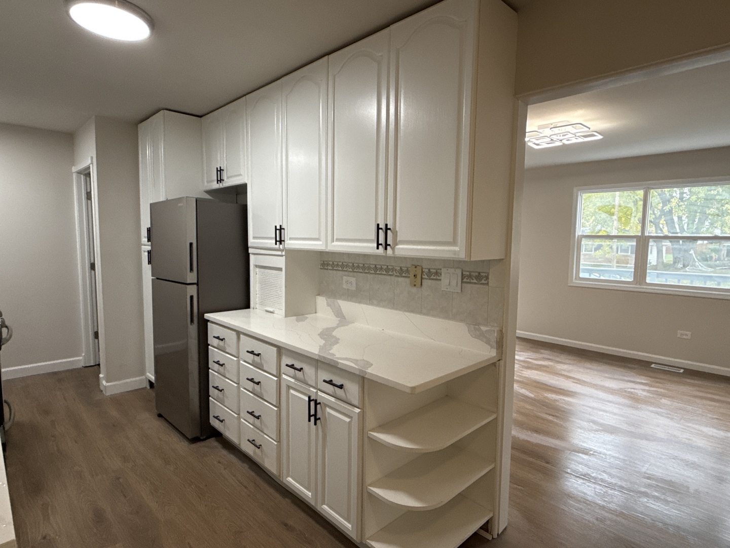 901 Gael Drive, Unit B Joliet, IL 60435 - Photo 7 of 17 a kitchen with stainless steel appliances granite countertop a refrigerator and a stove