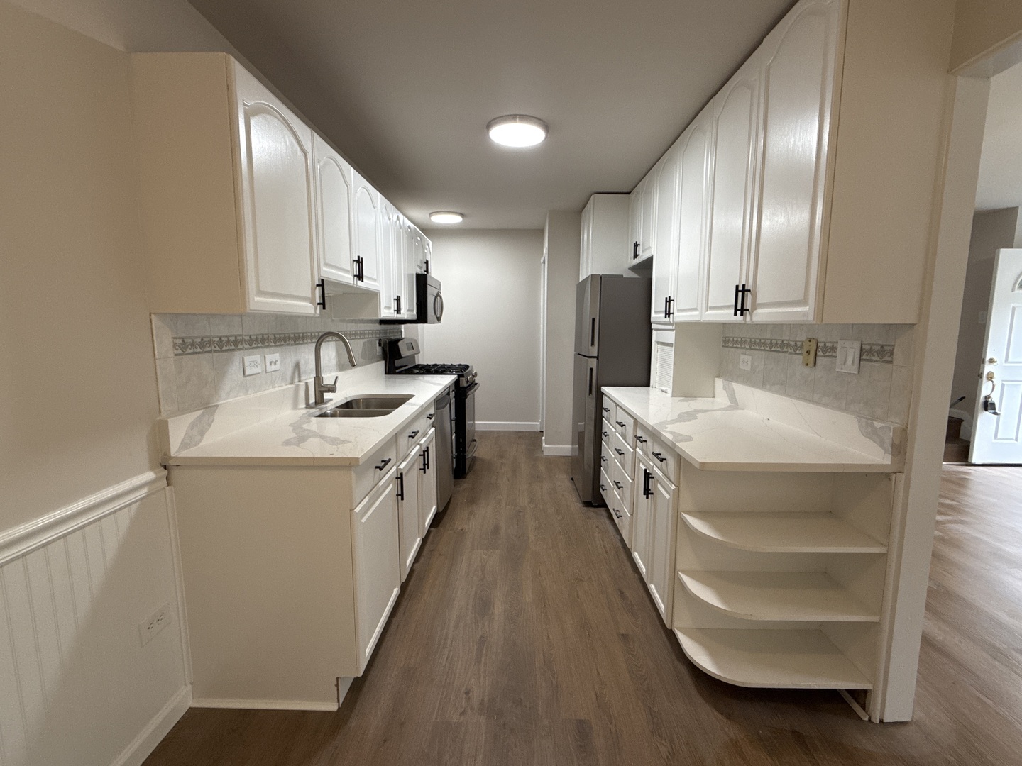901 Gael Drive, Unit B Joliet, IL 60435 - Photo 8 of 17 a bathroom with double vanity and mirrors