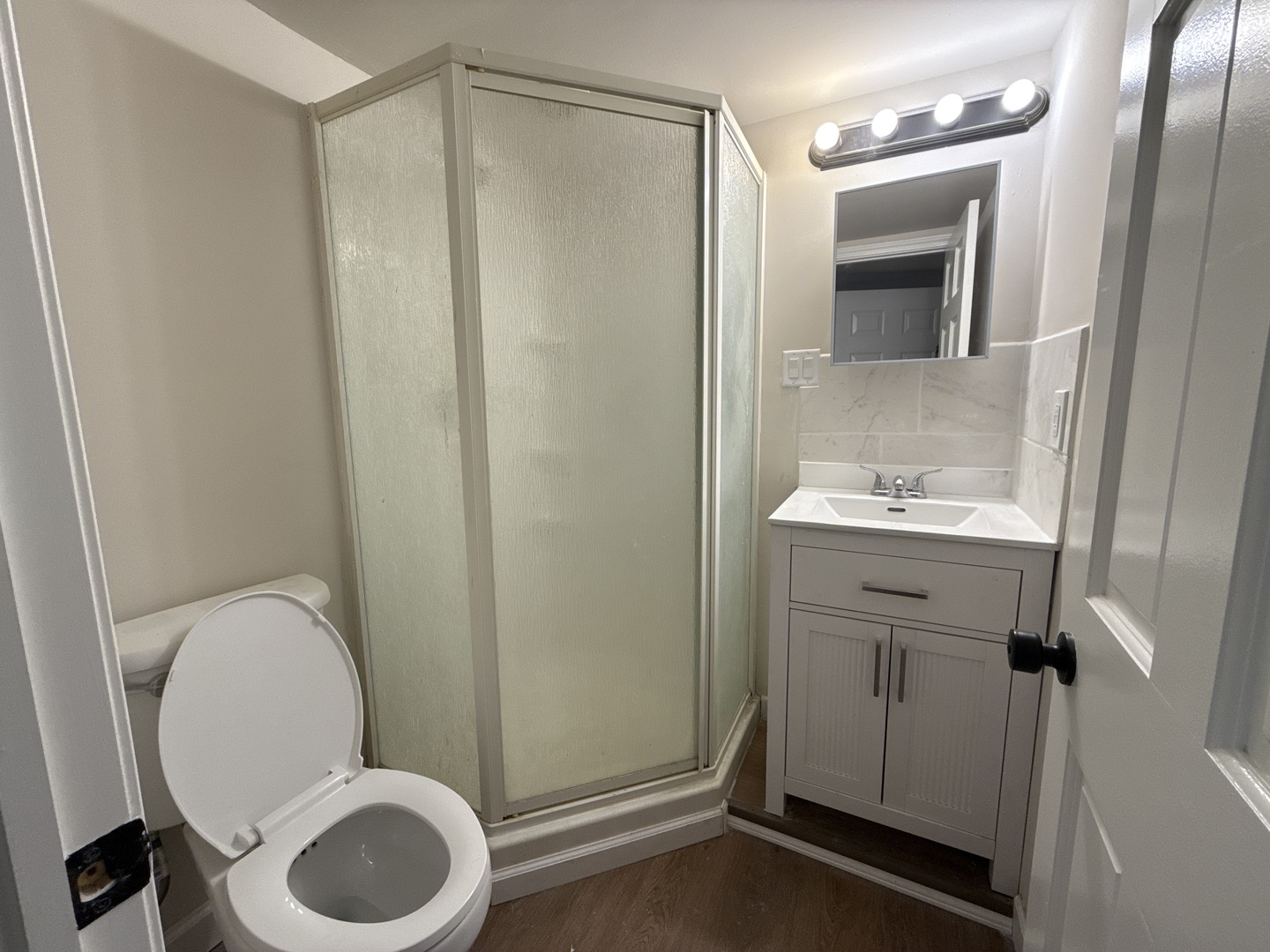 901 Gael Drive, Unit B Joliet, IL 60435 - Photo 9 of 17 a bathroom with a granite countertop toilet sink and mirror