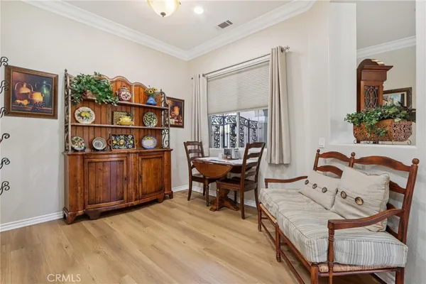 a living room with stainless steel appliances kitchen island granite countertop furniture and a kitchen view
