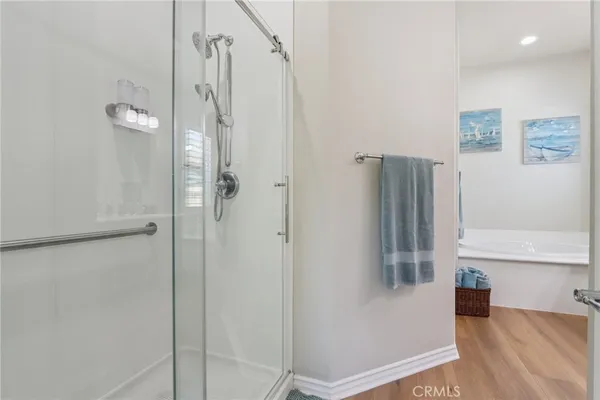 a bathroom with a sink a toilet and a large mirror