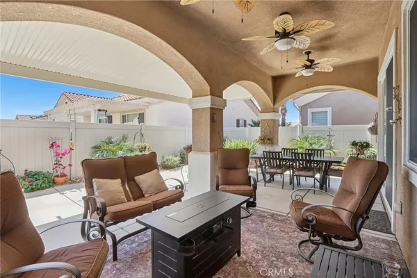 a view of a dining room with furniture wooden floor and chandelier