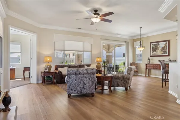 a living room with furniture and a chandelier